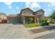 Inviting two-story home with a two car garage, well manicured lawn, and inviting porch at 14364 W Cameron Dr, Surprise, AZ 85379