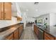 Open-concept kitchen and living area showcases stainless appliances, granite counters, and seamless living at 14364 W Cameron Dr, Surprise, AZ 85379