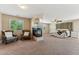 Serene main bedroom featuring a cozy fireplace, carpeted floor, and plenty of natural light at 14364 W Cameron Dr, Surprise, AZ 85379