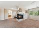 Spacious main bedroom with fireplace, carpeted floors, and windows letting in lots of light at 14364 W Cameron Dr, Surprise, AZ 85379