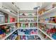 Spacious pantry featuring organized shelves and ample storage for all your culinary needs at 14364 W Cameron Dr, Surprise, AZ 85379