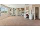 Large walk-in closet with custom shelving and vanity providing ample storage and organization at 14364 W Cameron Dr, Surprise, AZ 85379