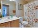 Neat bathroom featuring a shower, a sink with good counterspace and neutral color palette at 17765 W Ventura St, Surprise, AZ 85388