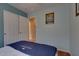Comfortable bedroom with double closets and light walls, perfect for relaxing at 17765 W Ventura St, Surprise, AZ 85388