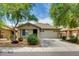 Attractive single-story home with a tile roof, landscaped front yard and two-car garage at 17765 W Ventura St, Surprise, AZ 85388