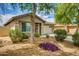 Charming single-story home featuring desert landscaping and a two-car garage at 17765 W Ventura St, Surprise, AZ 85388