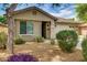 Inviting single-story home featuring well-kept landscaping and a charming facade at 17765 W Ventura St, Surprise, AZ 85388
