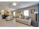 Bright and airy living room with tile floors, comfortable seating, and stylish decor at 17765 W Ventura St, Surprise, AZ 85388