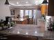 Spacious kitchen featuring granite countertops, a breakfast bar, and modern appliances at 1819 E Sheena Dr, Phoenix, AZ 85022