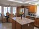 Well-lit kitchen featuring granite countertops, stainless steel appliances, and ample cabinet space at 1819 E Sheena Dr, Phoenix, AZ 85022