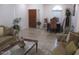 Inviting living room with hardwood floors, comfortable seating, and a formal dining area at 1819 E Sheena Dr, Phoenix, AZ 85022