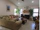 Cozy living room with a fireplace, comfortable seating, and plenty of natural light at 1819 E Sheena Dr, Phoenix, AZ 85022