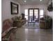 Bright living room featuring hardwood floors, elegant seating, and large windows at 1819 E Sheena Dr, Phoenix, AZ 85022