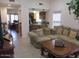 Comfortable living room with hardwood floors, a large sectional sofa, and natural light at 1819 E Sheena Dr, Phoenix, AZ 85022