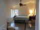 Spacious main bedroom with a fan, large window with shades and a comfortable layout at 1819 E Sheena Dr, Phoenix, AZ 85022