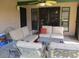 Covered outdoor patio area featuring comfortable seating, and tile flooring with overhead ceiling fan at 1819 E Sheena Dr, Phoenix, AZ 85022