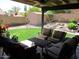 Cozy covered patio with comfortable seating, perfect for relaxing and enjoying the outdoors at 1819 E Sheena Dr, Phoenix, AZ 85022