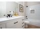 Bathroom featuring a shower/tub combination, modern vanity and fixtures at 19608 N Regents Park Dr, Surprise, AZ 85387