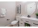 Powder room featuring a pedestal sink, modern vanity and fixtures at 19608 N Regents Park Dr, Surprise, AZ 85387