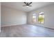 Bedroom featuring vaulted ceilings and large windows at 19608 N Regents Park Dr, Surprise, AZ 85387