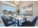 Stylish dining area with a modern table set and expansive window view at 19608 N Regents Park Dr, Surprise, AZ 85387