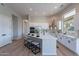 Bright kitchen with a large island, modern appliances, and ample counter space for cooking at 19608 N Regents Park Dr, Surprise, AZ 85387