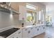 Contemporary kitchen featuring sleek cabinetry, quartz countertops, and modern stainless steel appliances at 19608 N Regents Park Dr, Surprise, AZ 85387