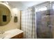 Bathroom featuring stylish gray tile shower, vanity, and round mirror at 20609 N 4Th Ave, Phoenix, AZ 85027