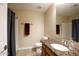 Cozy bathroom featuring granite countertop, tile floors, and shower with dark curtain at 20609 N 4Th Ave, Phoenix, AZ 85027
