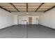 Spacious three-car garage with epoxy flooring, washer, dryer, and water heater ready for use at 20609 N 4Th Ave, Phoenix, AZ 85027