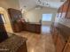 Well-lit kitchen featuring granite counters and wood cabinets, with attached dining area at 20609 N 4Th Ave, Phoenix, AZ 85027