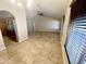 Open-concept living area boasts neutral walls, ceiling fan, and large windows for ample natural light at 20609 N 4Th Ave, Phoenix, AZ 85027