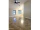 Spacious living room with tile flooring, ceiling fan, and plenty of natural light at 20609 N 4Th Ave, Phoenix, AZ 85027