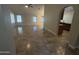 Open-concept living room boasts tile floors and leads into kitchen space at 20609 N 4Th Ave, Phoenix, AZ 85027