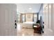 Bright main bedroom with an en-suite bathroom, neutral walls, and tile floors at 20609 N 4Th Ave, Phoenix, AZ 85027