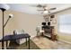 Cozy home office with a computer, ceiling fan, and a chair; perfect for remote work or studying at 20609 N 4Th Ave, Phoenix, AZ 85027
