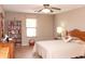 Bright bedroom featuring neutral walls, tile floor, ceiling fan, and a well-lit window for natural light at 2101 S Meridian Rd # 176, Apache Junction, AZ 85120