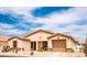 Charming single-story home with a well-manicured front yard, desert landscaping, and a two-car garage at 2101 S Meridian Rd # 176, Apache Junction, AZ 85120