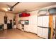 Organized garage space featuring built-in cabinets, storage bins, and a clean, well-maintained floor at 2101 S Meridian Rd # 176, Apache Junction, AZ 85120