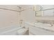 Clean, compact bathroom featuring tiled walls, a shower/tub combo, and a classic vanity at 2145 W Cholla St, Phoenix, AZ 85029