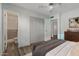Serene bedroom with a view into the ensuite bath, spacious closets, and modern furnishings, offering plenty of storage at 2145 W Cholla St, Phoenix, AZ 85029