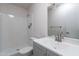Bright bathroom featuring a modern vanity with updated fixtures and a clean, well-maintained shower at 2440 N 22Nd Ave, Phoenix, AZ 85009