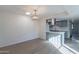 Bright dining area featuring an updated light fixture next to a modern kitchen at 2440 N 22Nd Ave, Phoenix, AZ 85009