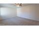 Bright, empty bedroom offering neutral decor and plush carpeting at 2440 N 22Nd Ave, Phoenix, AZ 85009