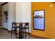 Cozy common area with a digital information screen and a small table with chairs at 27380 N 128Th Ln, Peoria, AZ 85383