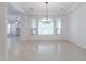 Bright dining room with neutral paint, tile floors, and a stylish chandelier at 27380 N 128Th Ln, Peoria, AZ 85383