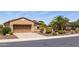 Lovely single-story home featuring a two-car garage, desert landscaping, and a well-maintained yard at 27380 N 128Th Ln, Peoria, AZ 85383