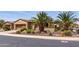 Attractive home boasting desert landscaping, mature trees, and a meticulously maintained front yard at 27380 N 128Th Ln, Peoria, AZ 85383