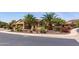 Beautiful single-story house featuring palm trees, desert landscaping, and meticulous curb appeal at 27380 N 128Th Ln, Peoria, AZ 85383