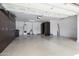 Spacious garage with storage cabinets and overhead lighting at 27380 N 128Th Ln, Peoria, AZ 85383